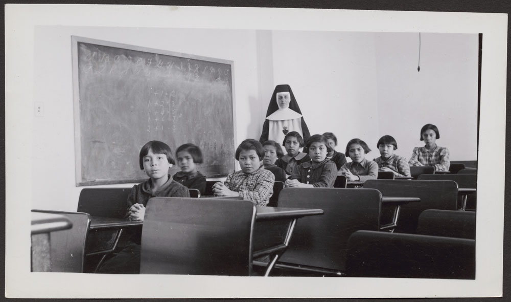 Group of female students and a nun