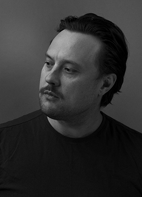 A black and white photo of filmmaker Conor McNally