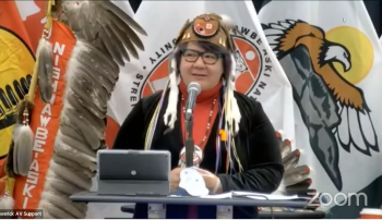 National Chief RoseAnne Archibald is seen at a podium.