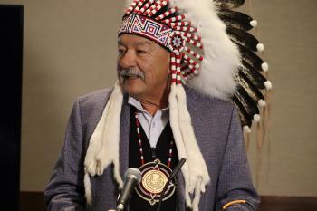 Grand Chief George Arcand, Jr. in a headdress
