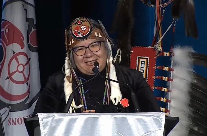 National Chief RoseAnne Archibald at podium smiling