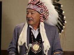Grand Chief George Arcand, Jr. in a headdress